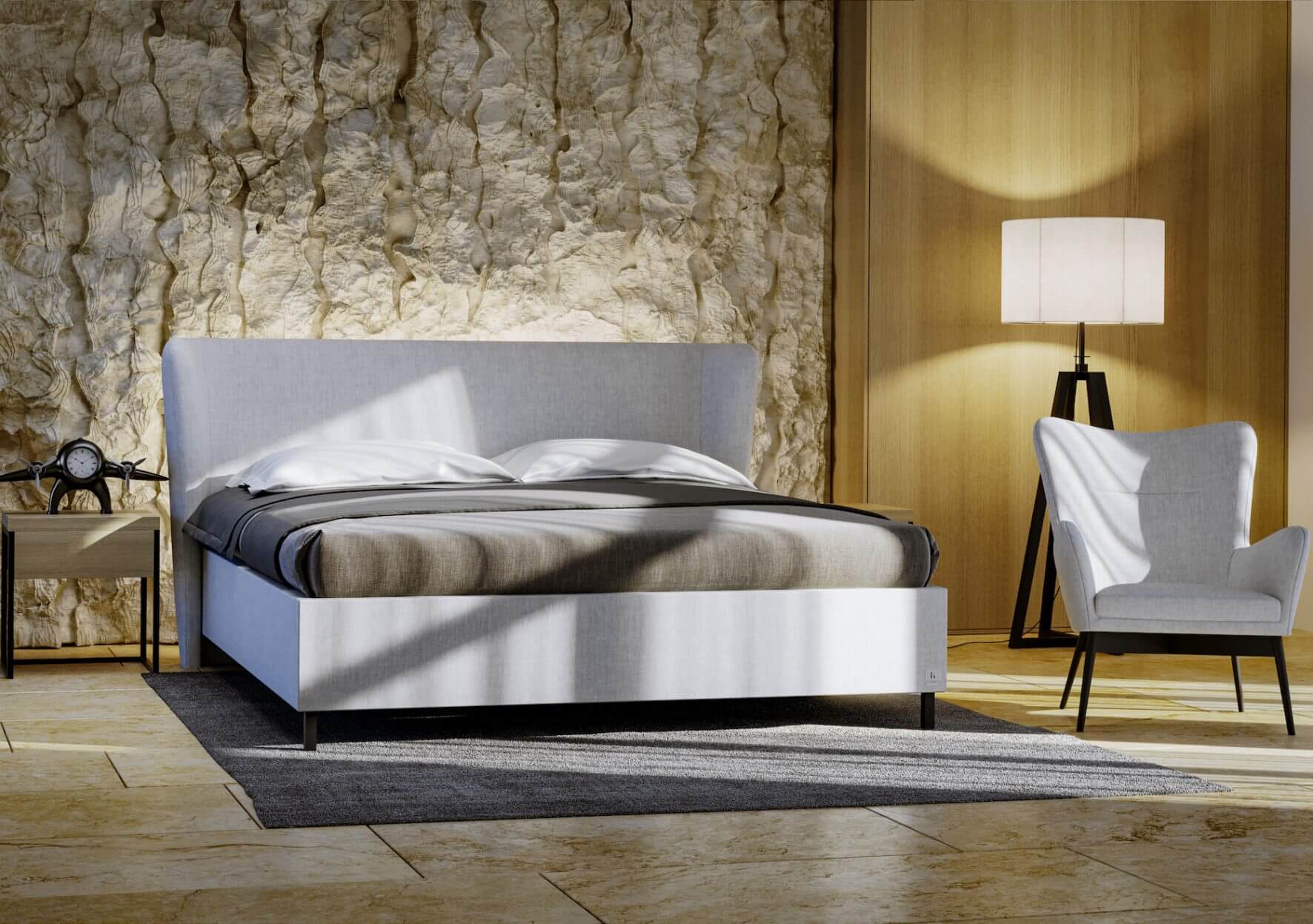 Luxusní postel s čalouněným čelem.